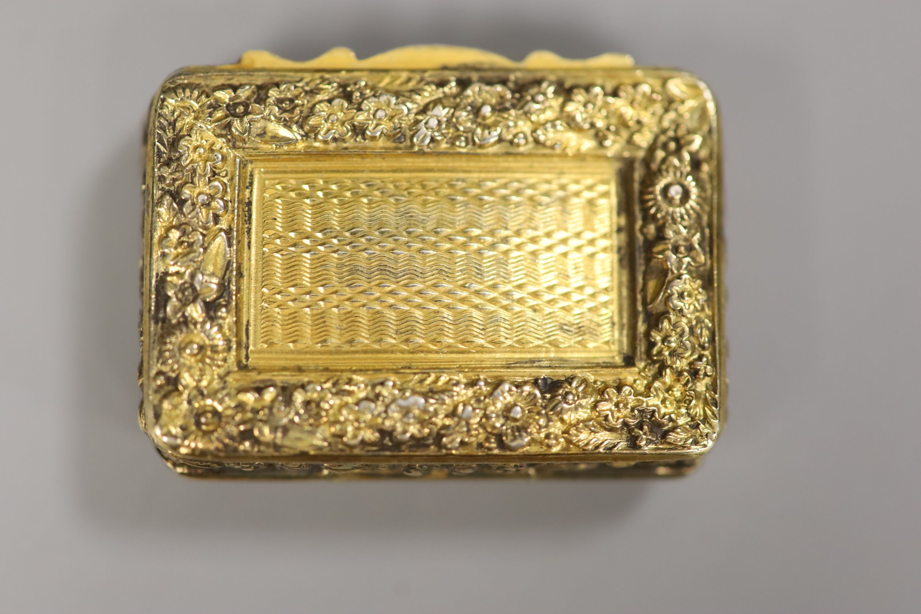 A late George III silver gilt rectangular vinaigrette, John Bettridge, Birmingham, 1819, 35mm & one other.